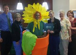 Amber Adams, RN, and group with the DAISY mascot